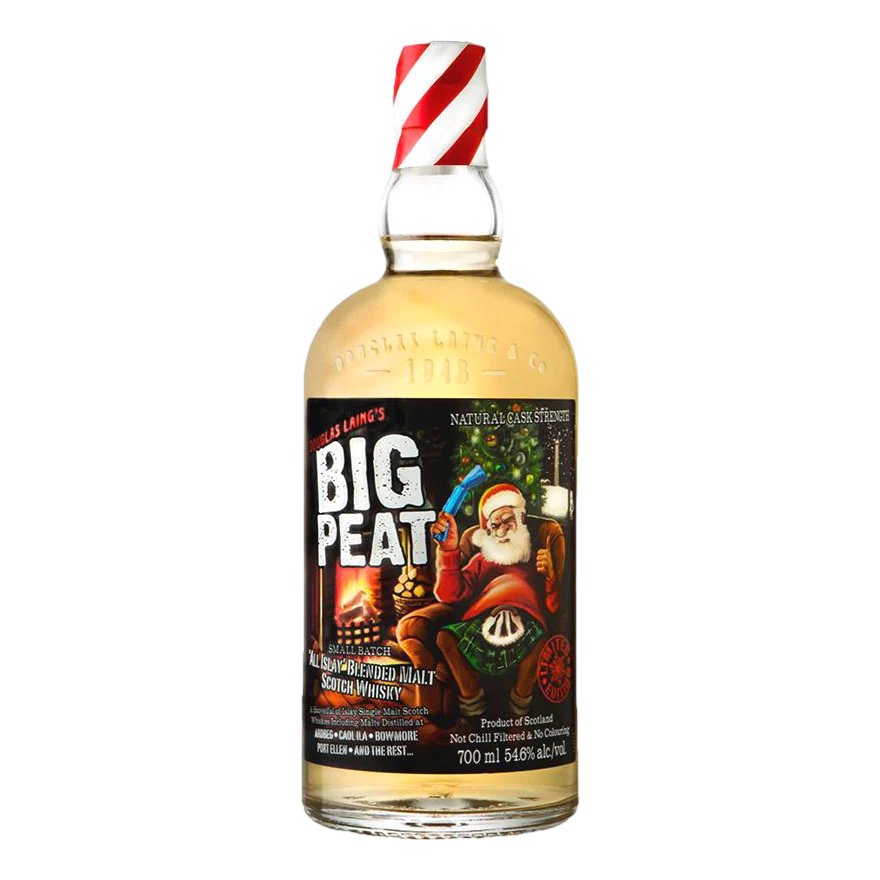A bottle of Douglas Laing's Big Peat Xmas Edition 2016 Islay Blended Malt Scotch Whisky with a festive label featuring Santa Claus and reindeer on a bottle with a red and white striped twist-top cap.