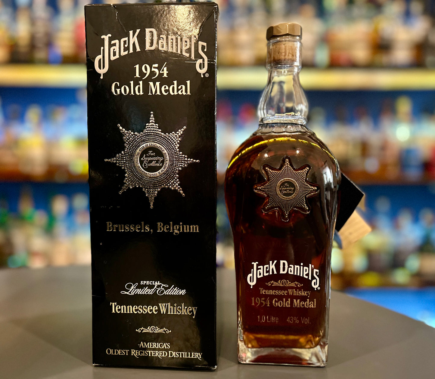 Jack Daniel's 1954 Gold Medal bottle and packaging on a bar counter.