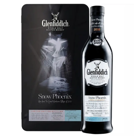 Glenfiddich Snow Phoenix bottle alongside its silver and black presentation box featuring the snowy  imagery.