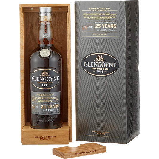 A bottle of Glengoyne 25 Year Old single malt Scotch whisky with its packaging, displaying the age and brand name, placed on a wooden surface.