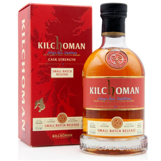 A bottle of Kilchoman Small Batch Release Oloroso Sherry Finish Cask Strength whisky next to its red packaging box.