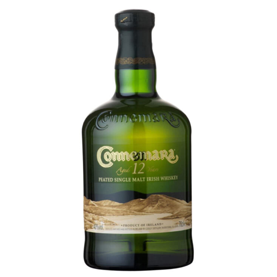 Green bottle of Connemara whiskey on a white background
