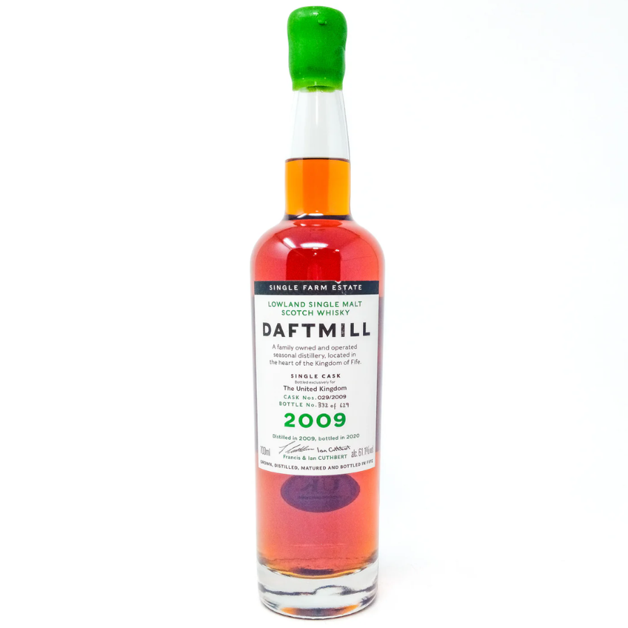 Bottle of Daftmill whisky with a green cap on a white background