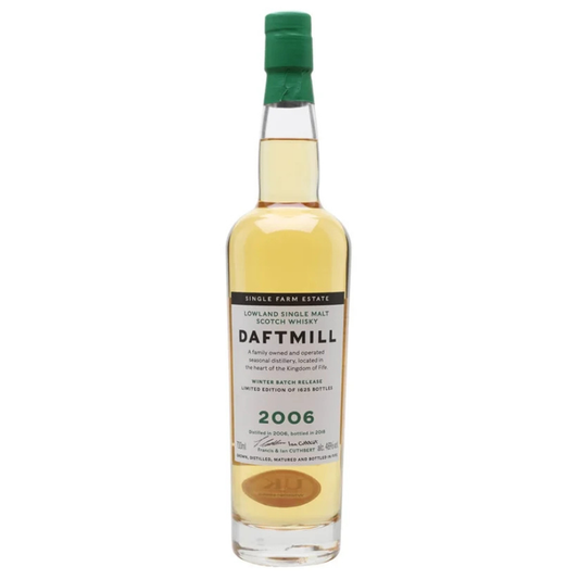 Daftmill whisky bottle with green cap on a white background