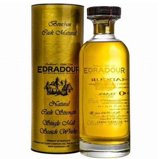 A decanter of Edradour Bourbon Cask Matured single malt Scotch whisky with a gold label, next to its packaging box.