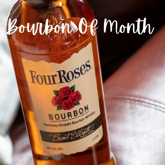 Four Roses bourbon bottle with a label and text 'Bourbon Of Month' on a blurred background.