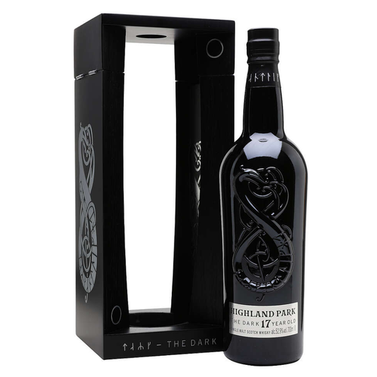Black Highland Park the Dark whisky bottle with decorative label and black box on white background