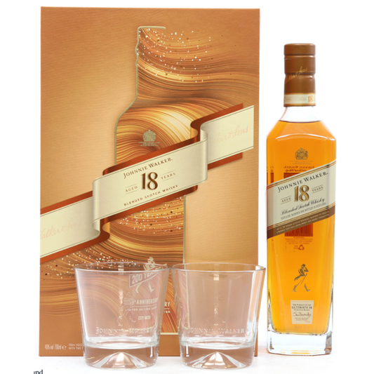 Johnnie Walker 18-year-old whisky set with bottle, glasses, and box on a white background