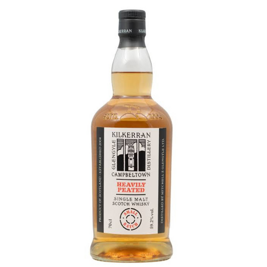 A bottle of Kilkerran Heavily Peated Batch 11 single malt Scotch whisky with a label indicating it is a release from the Glengyle Distillery.