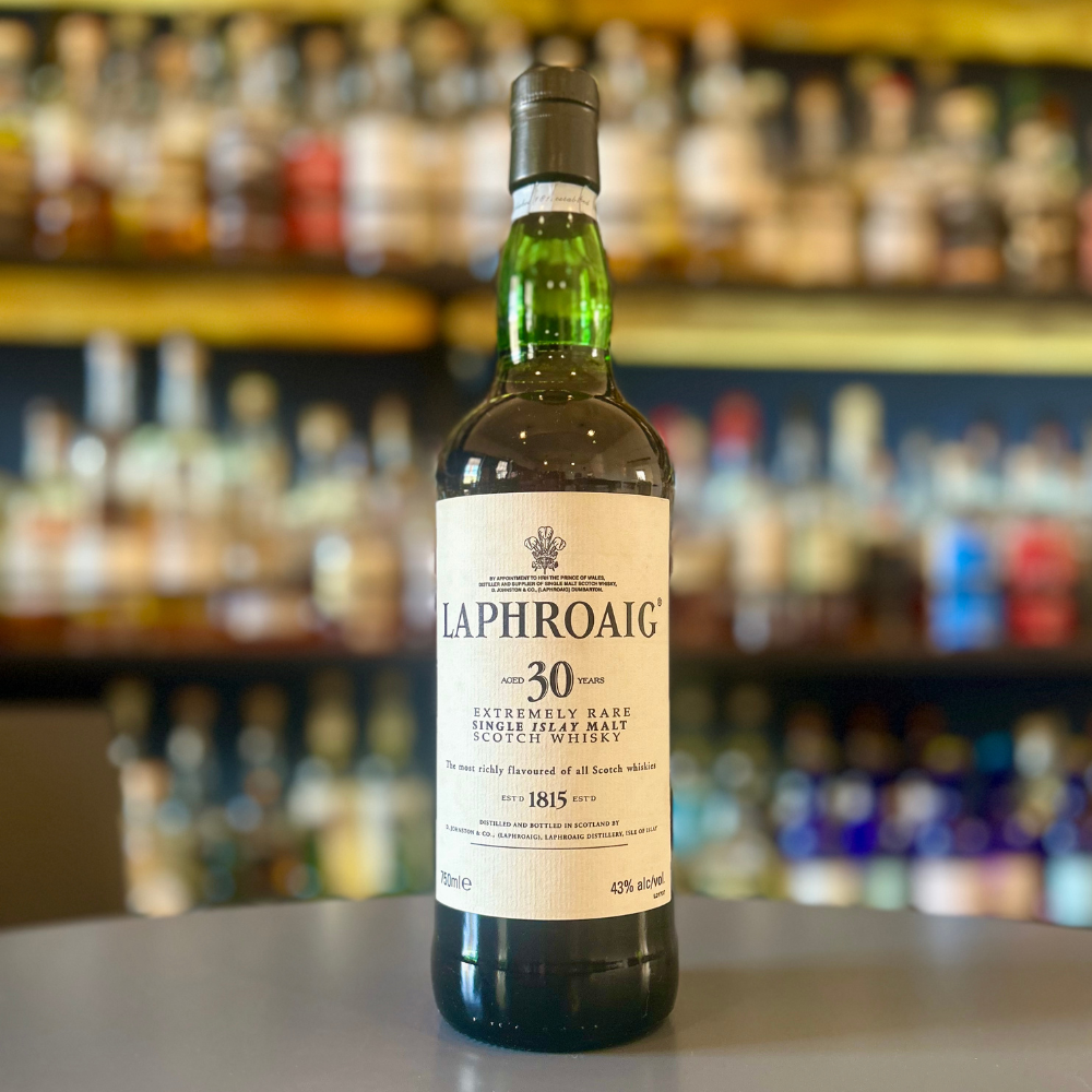 Laphroaig 30 Years Scotch bottle in the bar background